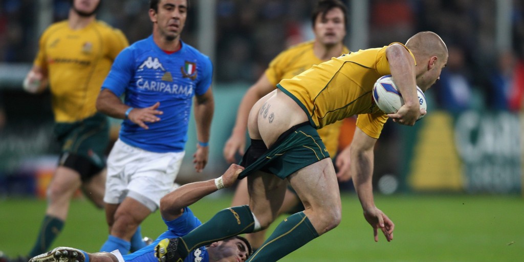 FLORENCE, ITALY - NOVEMBER 20: Drew Mitchell, the Wallaby wing, has his shorts pulled down by Edoardo Gori during the Test match between Italy and the Australian Wallabies at Stadio Artemio Franchi on November 20, 2010 in Florence, Italy. (Photo by David Rogers/Getty Images)