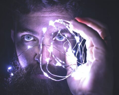 person holding string lights photo