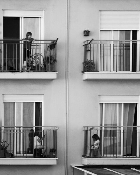 children playing on balconies of modern building